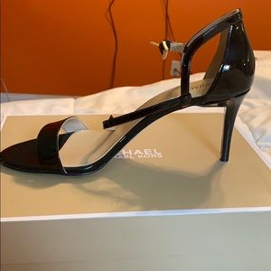 Brand new Michael Kors patent leather heel